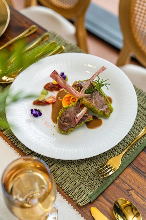 Chef preparing a gourmet meal in a modern kitchen setting.